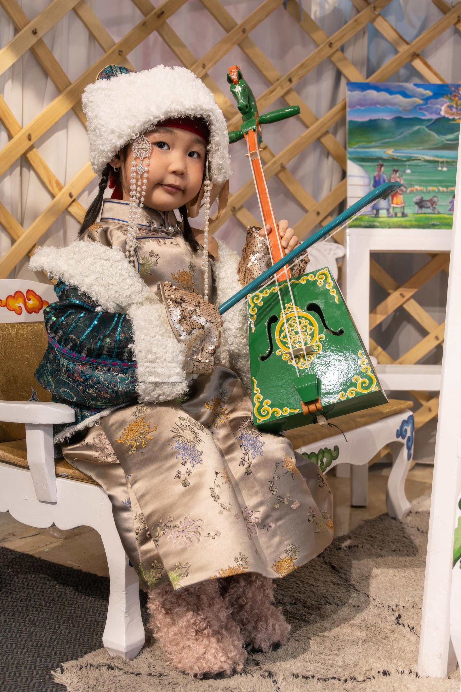 European Photography Awards Winner - MONGOLIAN GIRL PLAYING AN INSTRUMENT